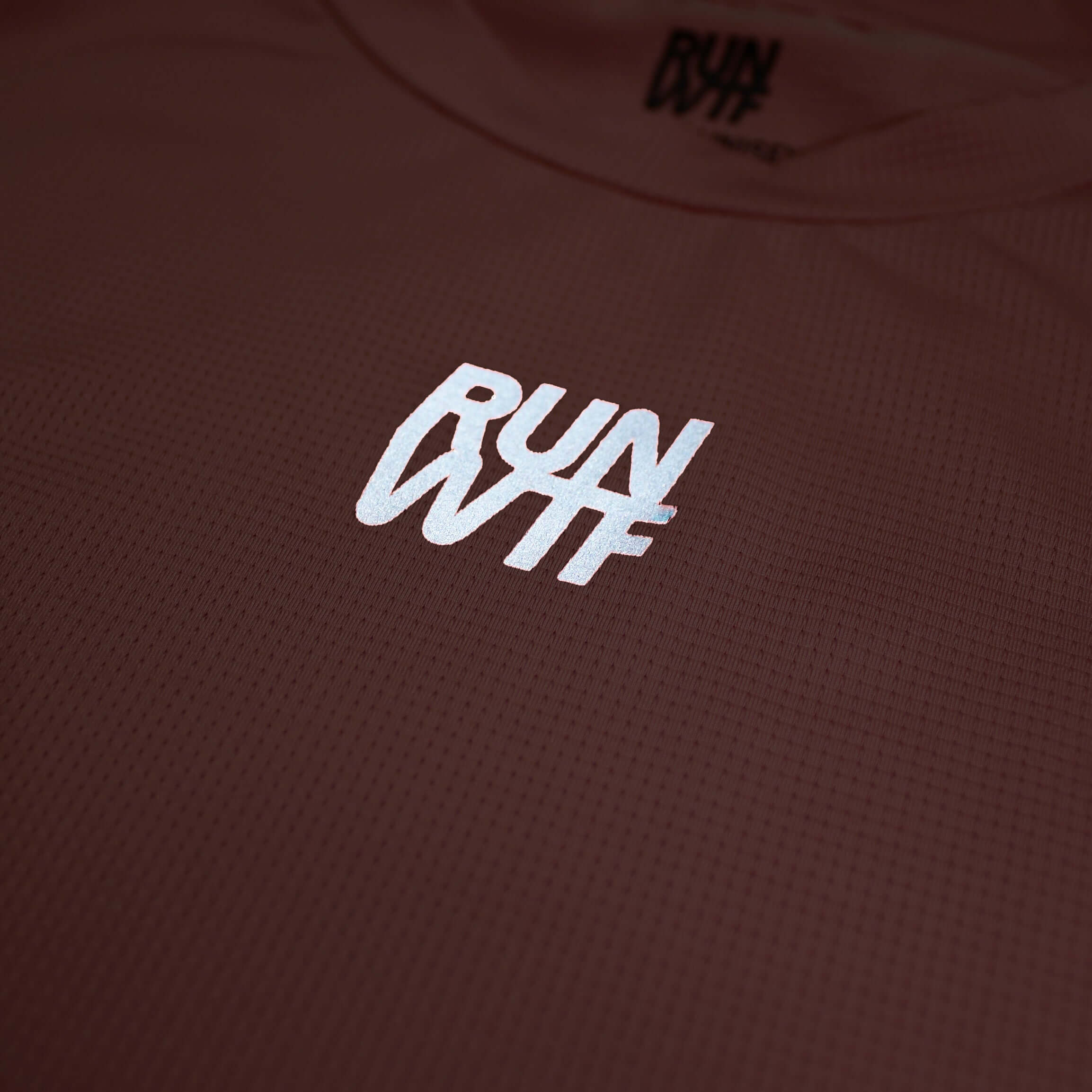 RUN WTF Running Apparel is an independent and fair label for running clothing. Shirt for high-intensity running. Light and breathable, made from recycled polyester. With large reflective prints for safety.